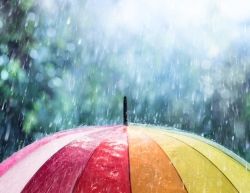 Regen fÃ¤llt auf einen bunten Regenschirm
